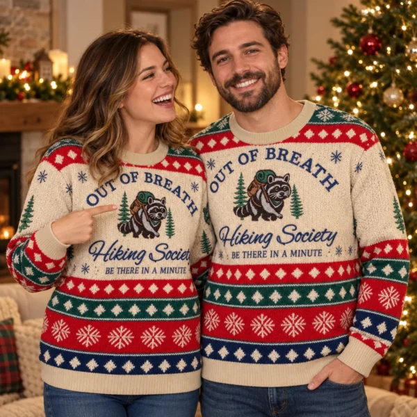 Couple wearing matching Out Of Breath Hiking Society Raccoon by the Christmas tree