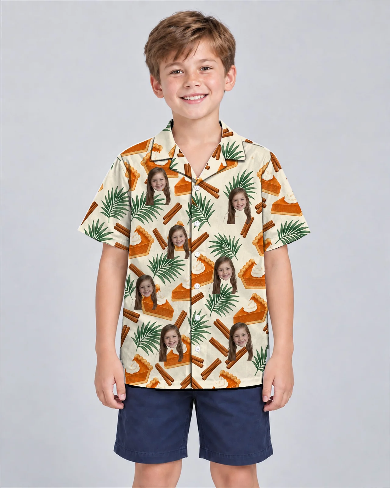 Kid wearing the Pumpkin Pie Paradise Thanksgiving Hawaiian Shirt with custom faces Kid wearing the Pumpkin Pie Paradise Thanksgiving Hawaiian Shirt with custom faces