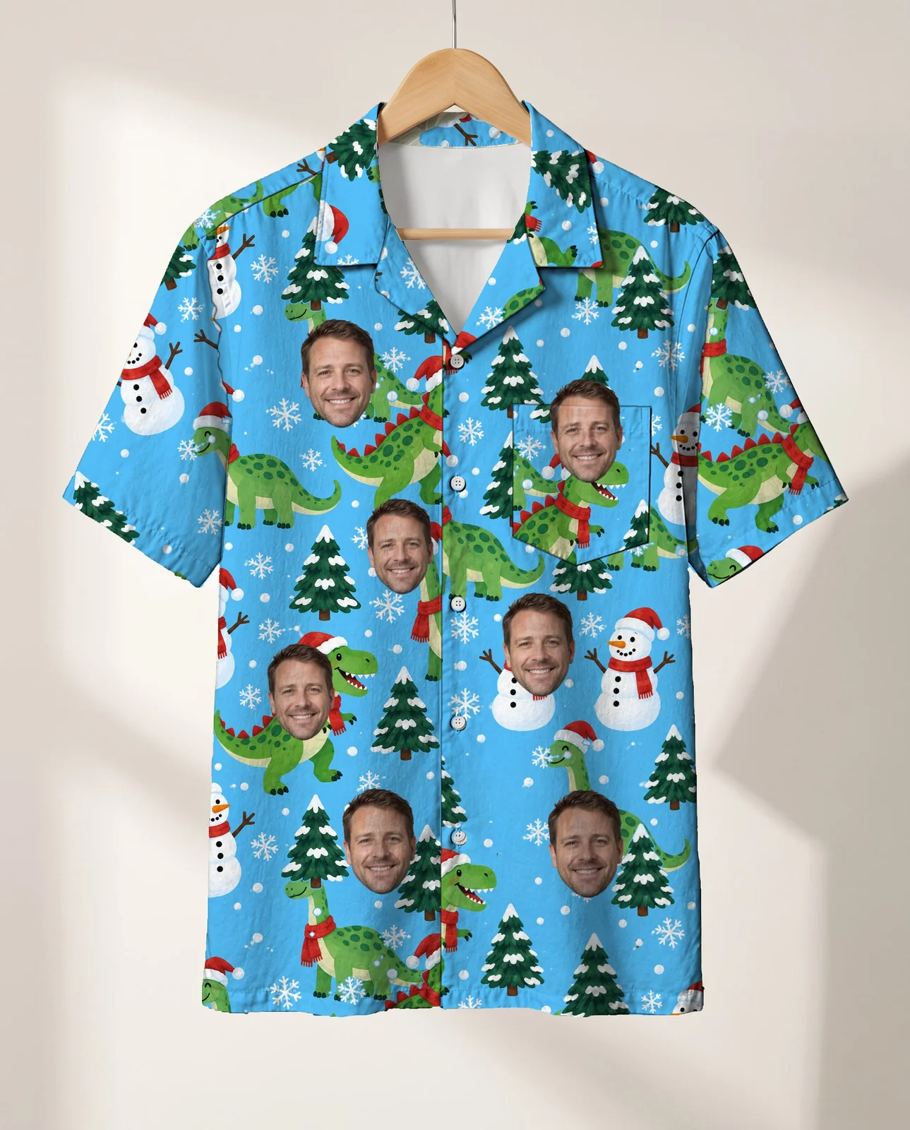 Snowy Dino Christmas Hawaiian Shirt personalized with faces, on a hanger Snowy Dino Christmas Hawaiian Shirt personalized with faces, on a hanger