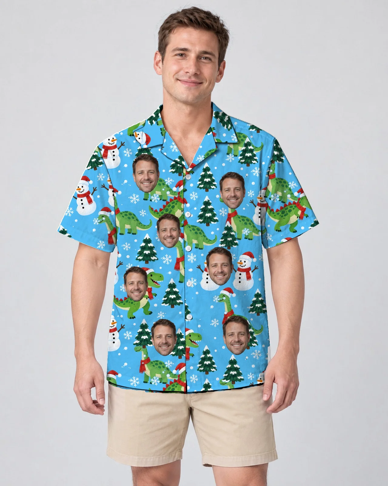 Man wearing the Snowy Dino Christmas Hawaiian Shirt with custom faces Man wearing the Snowy Dino Christmas Hawaiian Shirt with custom faces