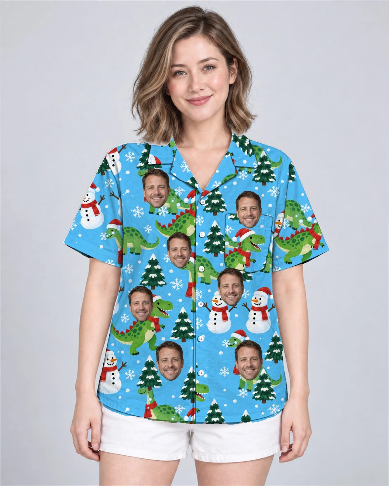 Woman wearing the Snowy Dino Christmas Hawaiian Shirt with custom faces Woman wearing the Snowy Dino Christmas Hawaiian Shirt with custom faces