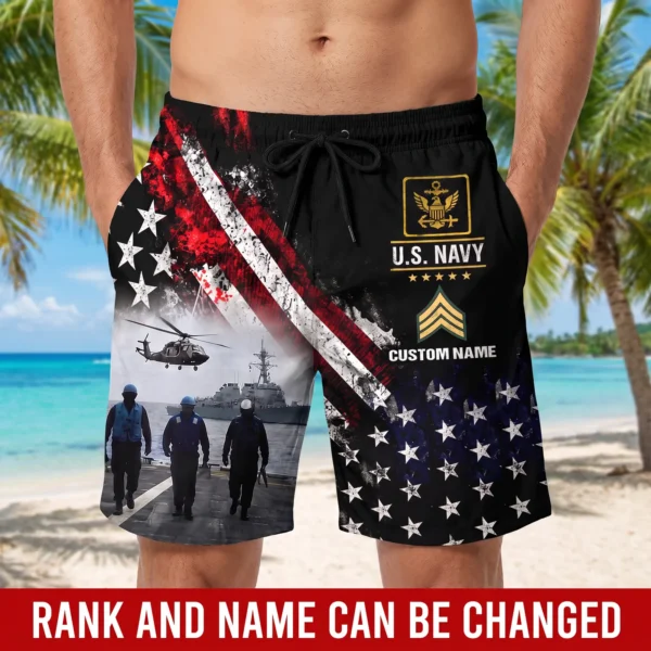 Man wearing the custom U.S. Navy beach shorts on a tropical beach