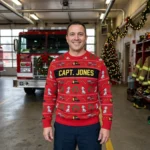 Personalized Firefighter Ugly Christmas Sweater With Name worn at Christmas